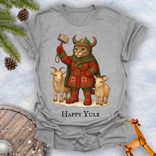 Gray t-shirt with a Thor lookalike cat in Viking costume, with goats and a hammer, text 'Happy Yule', on a snowy background.