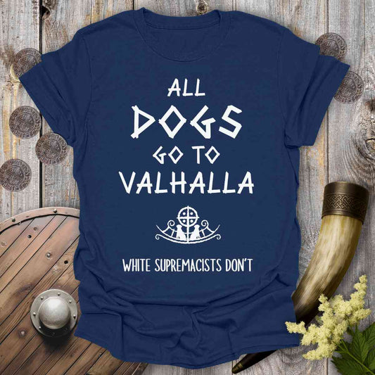 Navy blue t-shirt with white text 'all dogs go to Valhalla' on a wooden background