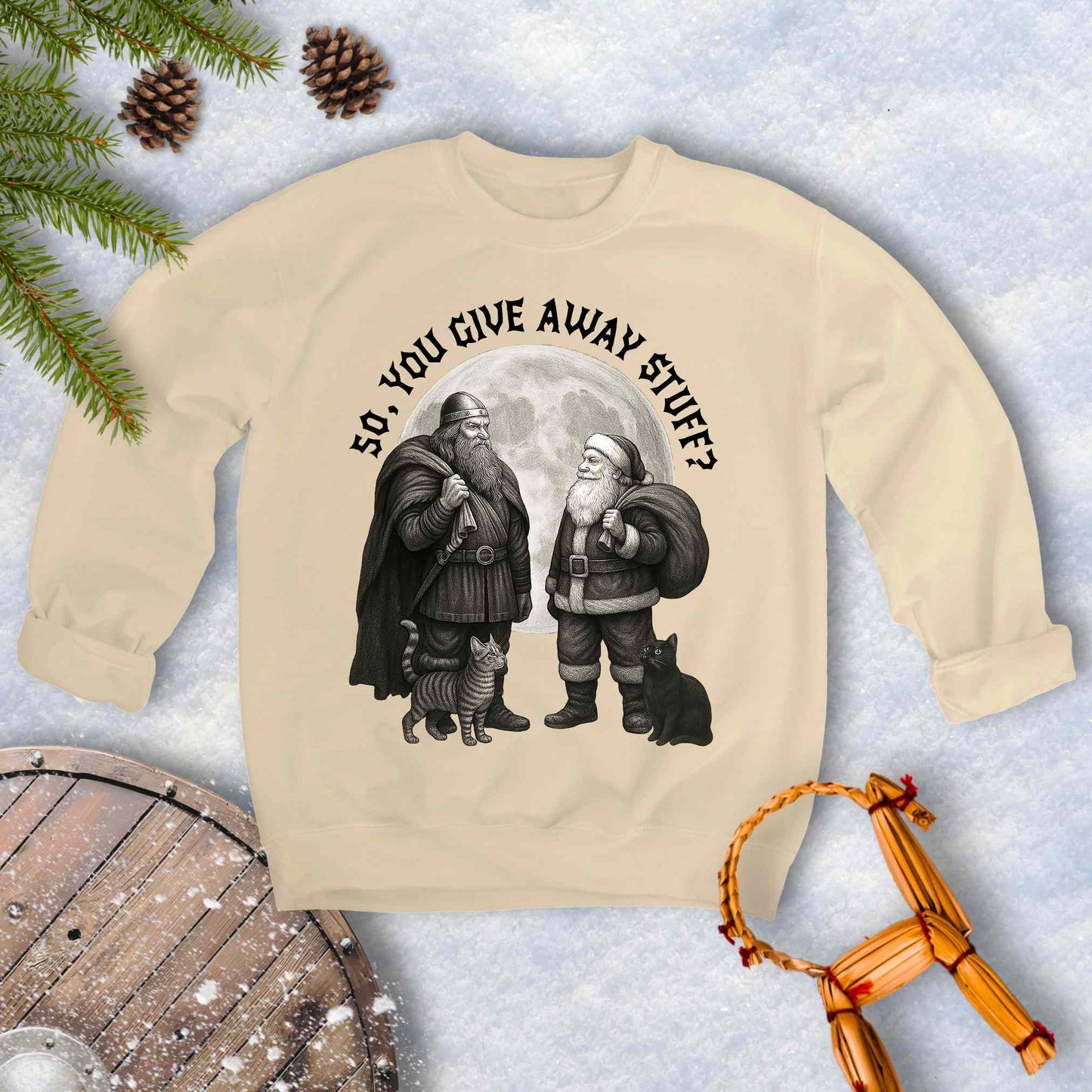 Beige Sand colored sweatshirt with graphic of a Viking and Santa Claus with two cats and text 'So, you give away stuff?'.