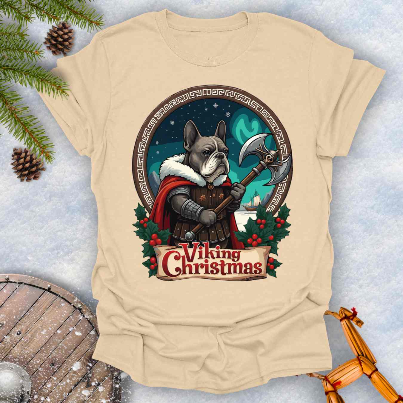 Beige Sand colored t-shirt with a Viking-themed Christmas design featuring a Viking Bulldog in armor with Northern lights behind it.