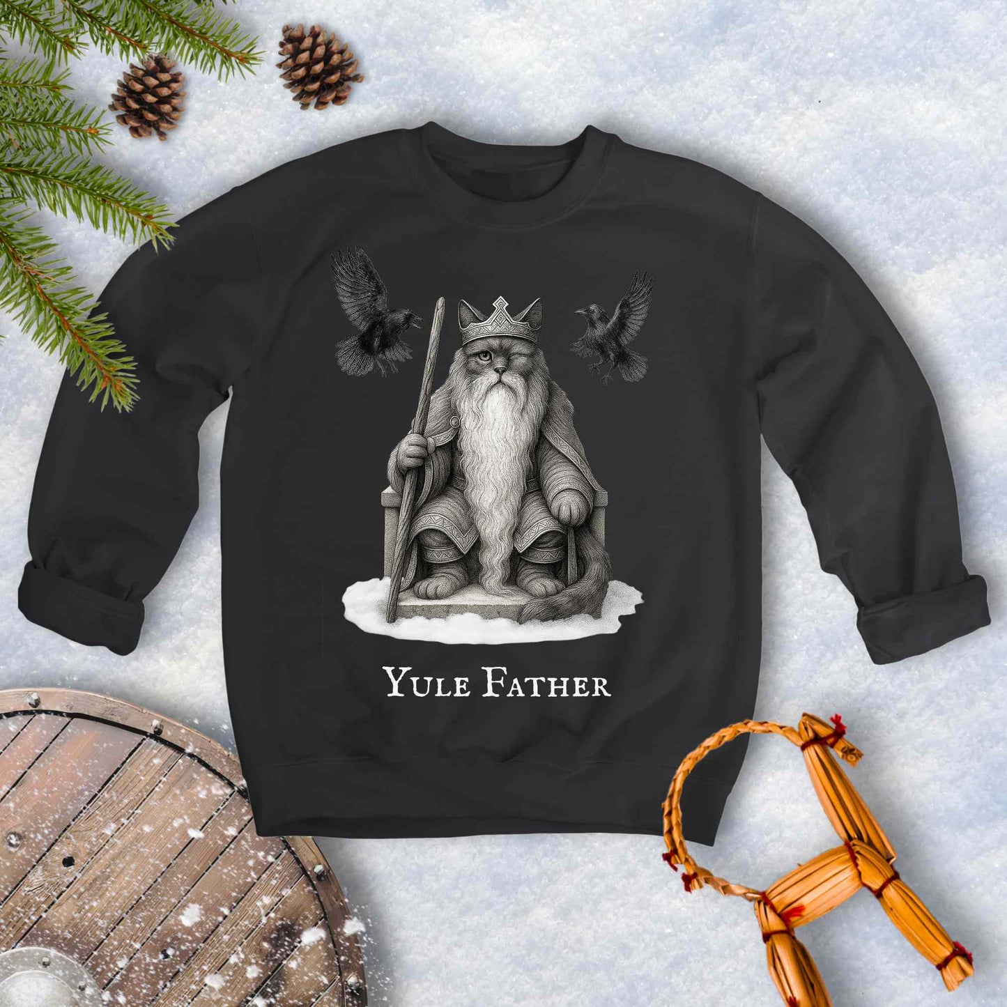 Black sweatshirt with the aesir Odin reimagined as a black cat. Text 'Yule Father' design on a snowy background.