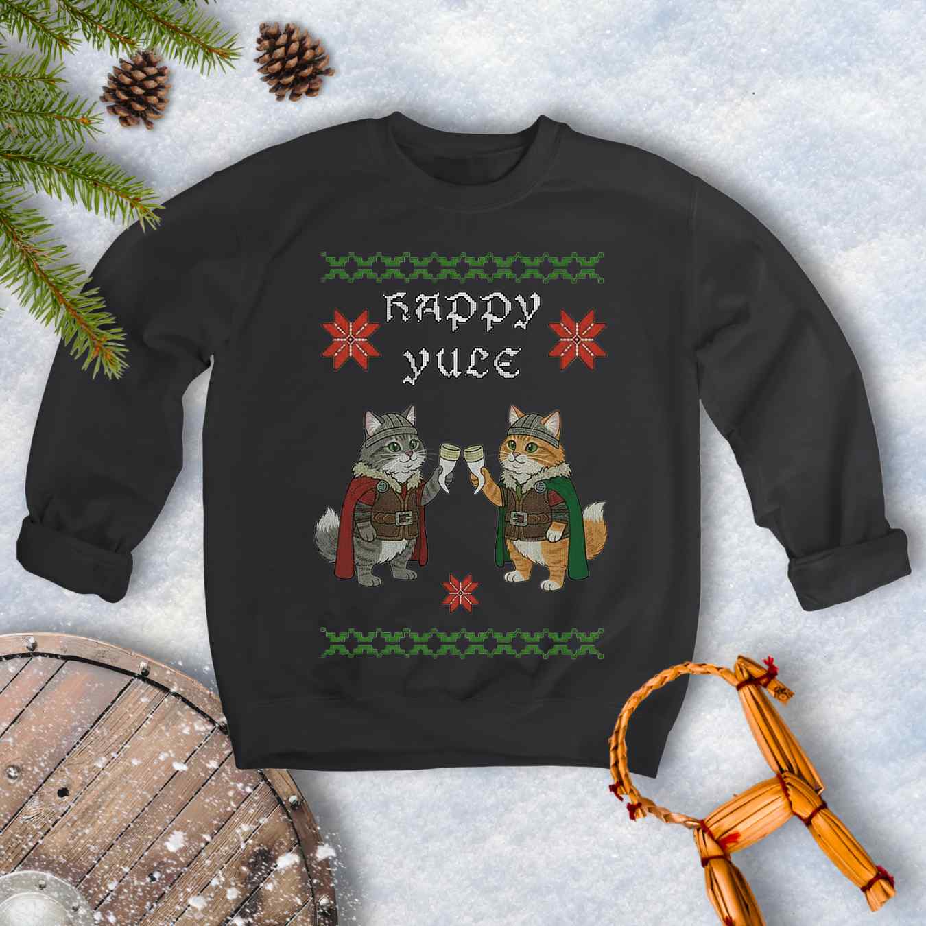 Black ugly sweater type sweatshirt with Viking cat design and 'Happy Yule' text on a snowy background.