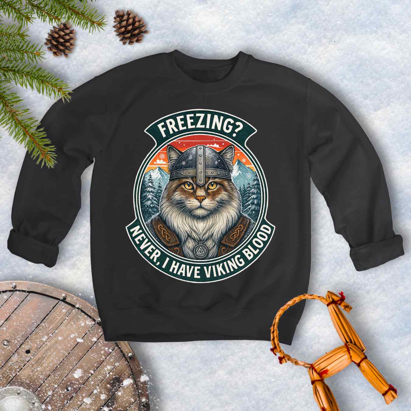 Black sweatshirt with a graphic of a Viking Norwegian Forest Cat and text 'Freezing? Never, I have Viking blood' with a Nordic, retro sunset graphic in the background.