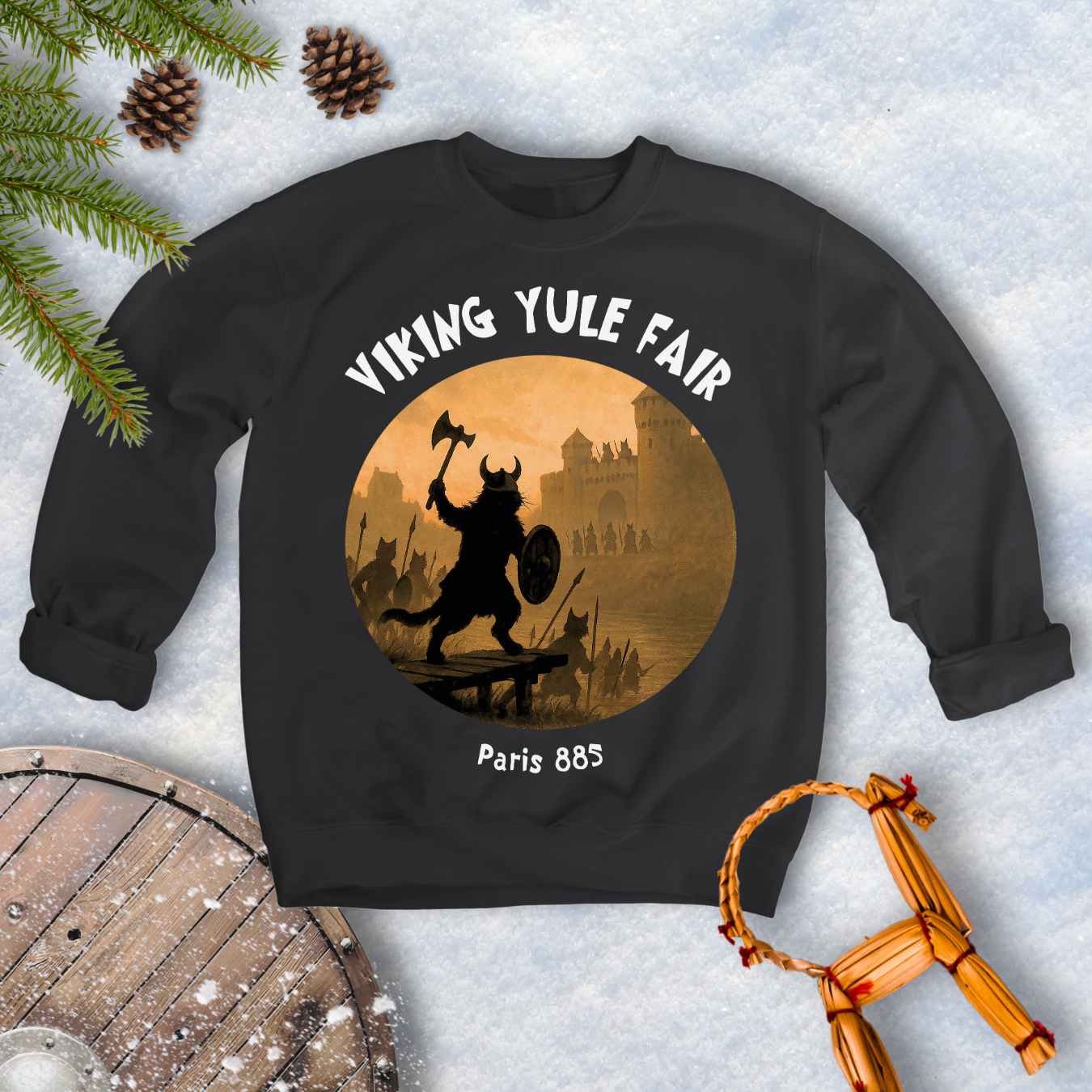 Black sweatshirt with Viking cat design and white 'Viking Yule Fair' and 'Paris 885’ text on a snowy background.