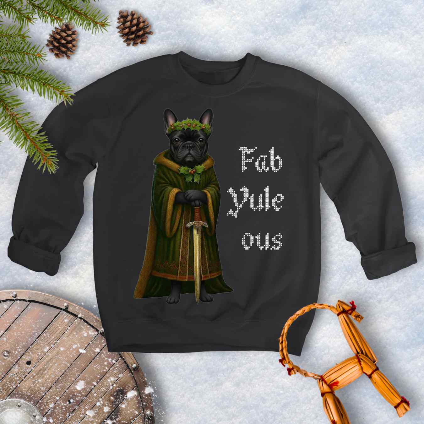 Black sweatshirt with a black shieldmaiden Bulldog in a green robe and sword, surrounded by Christmas decorations and vertical text 'Fab Yule ous'.