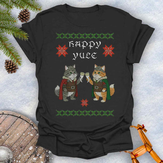 Black t-shirt with Holiday festive design, ugly sweater pattern style, of two Viking cats holding drinking horns and 'Happy Yule' text, surrounded by Christmas decorations on a snowy background.