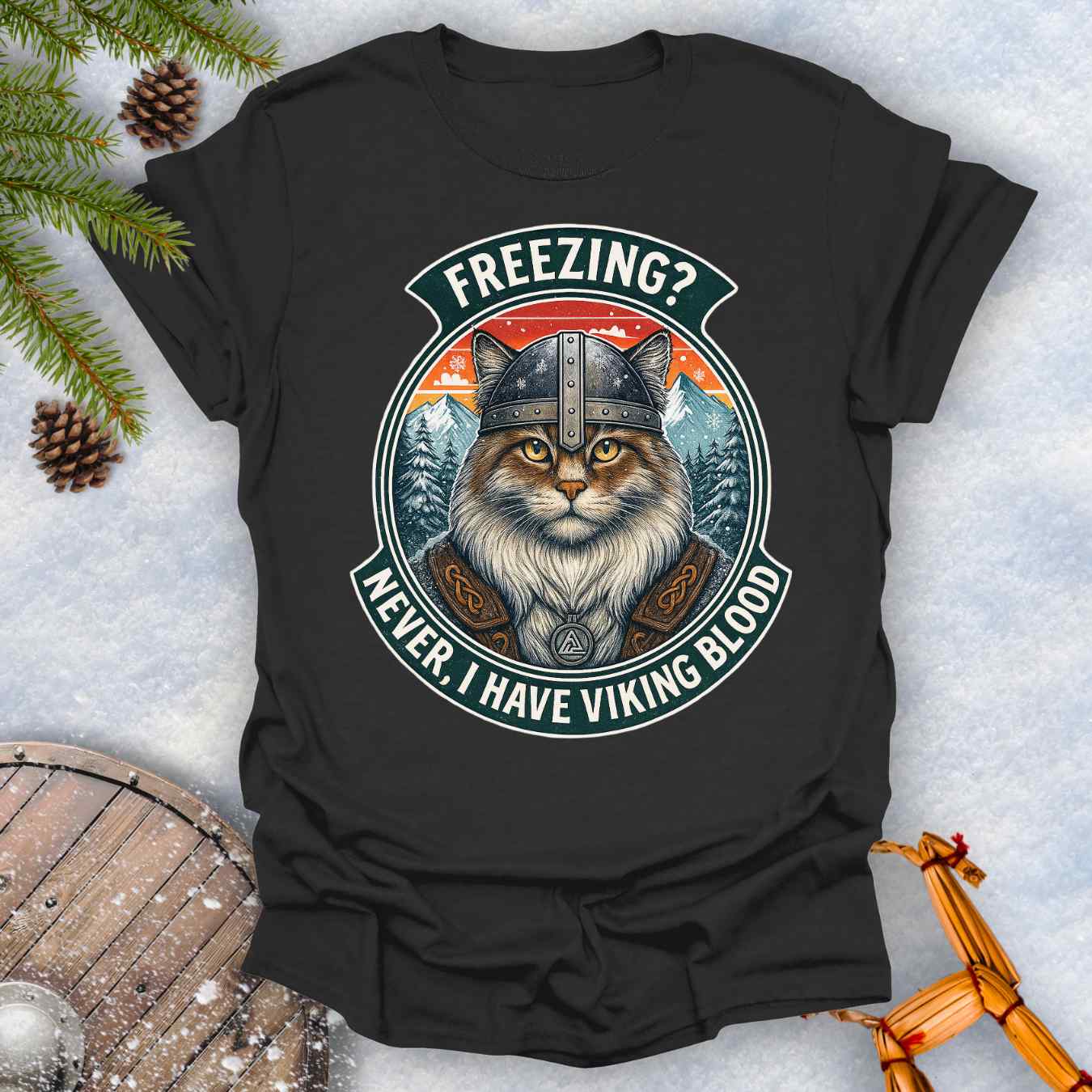 Black T-Shirt with a graphic of a Viking Norwegian Forest Cat and text 'Freezing? Never, I have Viking blood' with a Nordic, retro sunset graphic in the background.