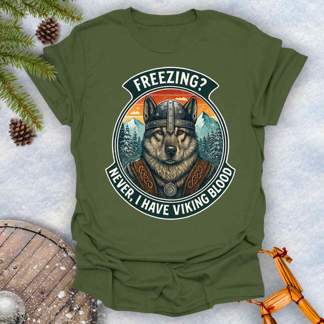 Forest Green t-shirt with a graphic of a Viking Norwegian Elkhound and text 'Freezing? Never, I have Viking blood' with a Nordic, retro sunset graphic in the background.