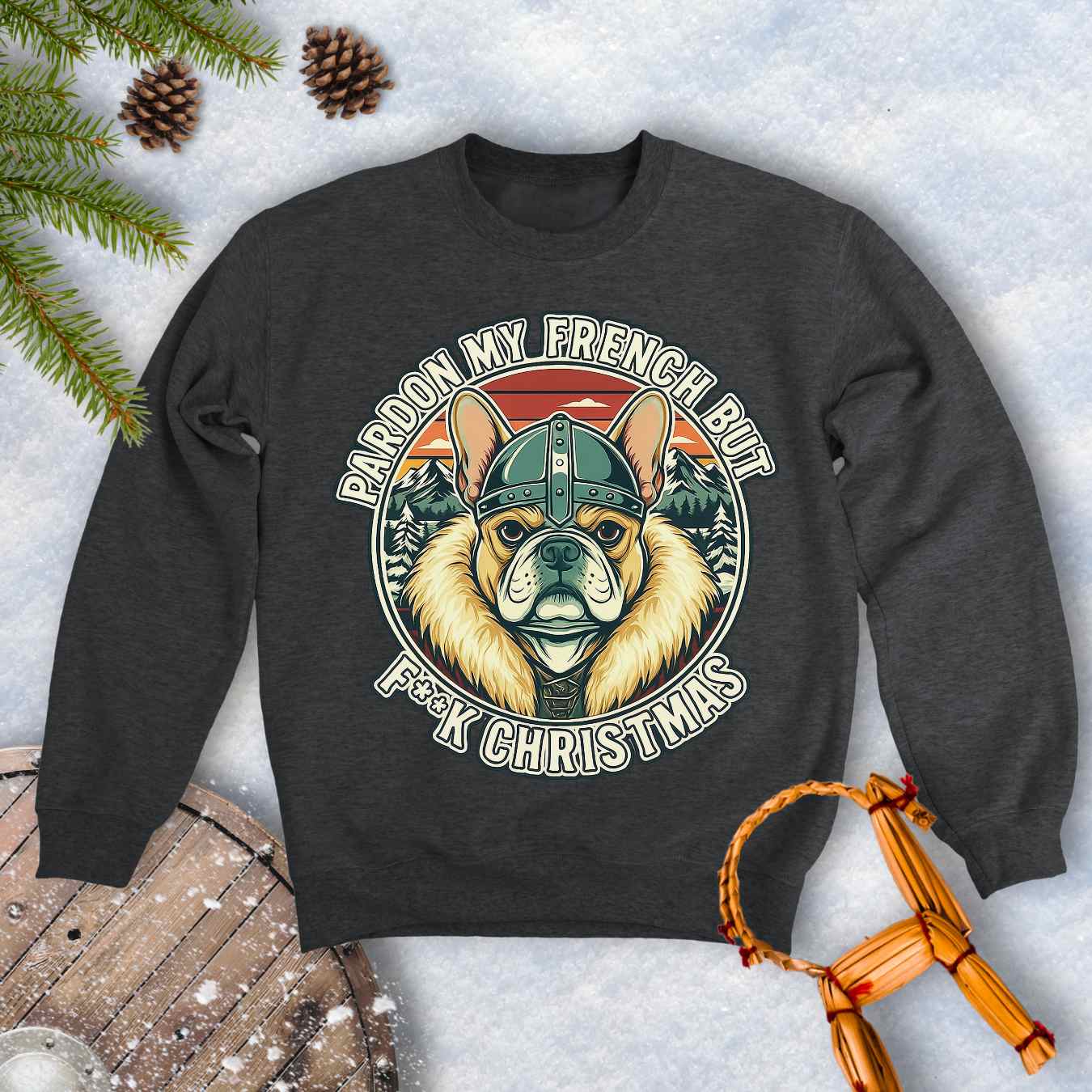 Dark Gray Dark Heater colored sweatshirt with a graphic of a Viking French bulldog wearing a helmet and Norse winter retro sunset in the background. Text "Pardon My French but F**K Christmas".