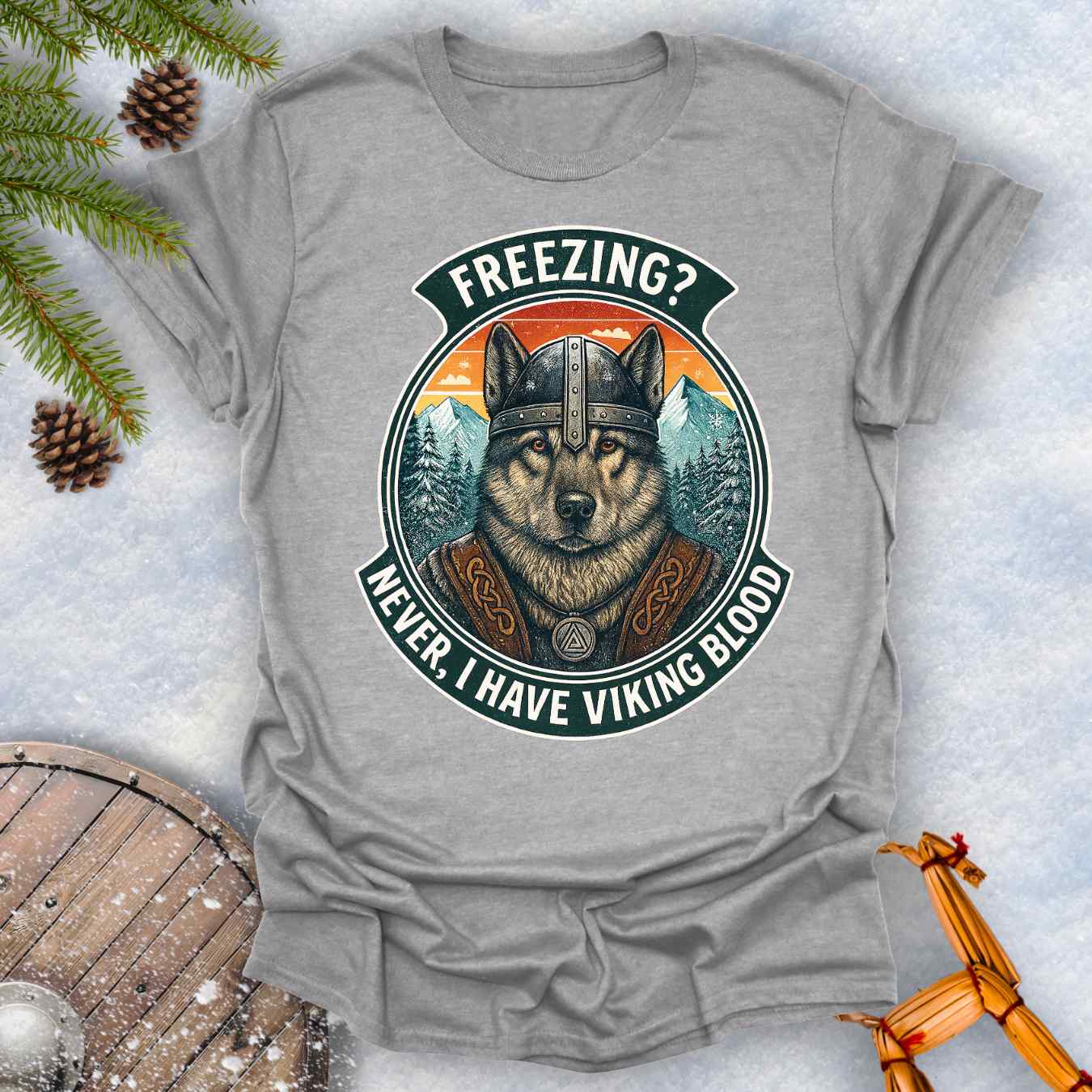 Gray Sports grey t-shirt with a graphic of a Viking Norwegian Elkhound and text 'Freezing? Never, I have Viking blood' with a Nordic, retro sunset graphic in the background.