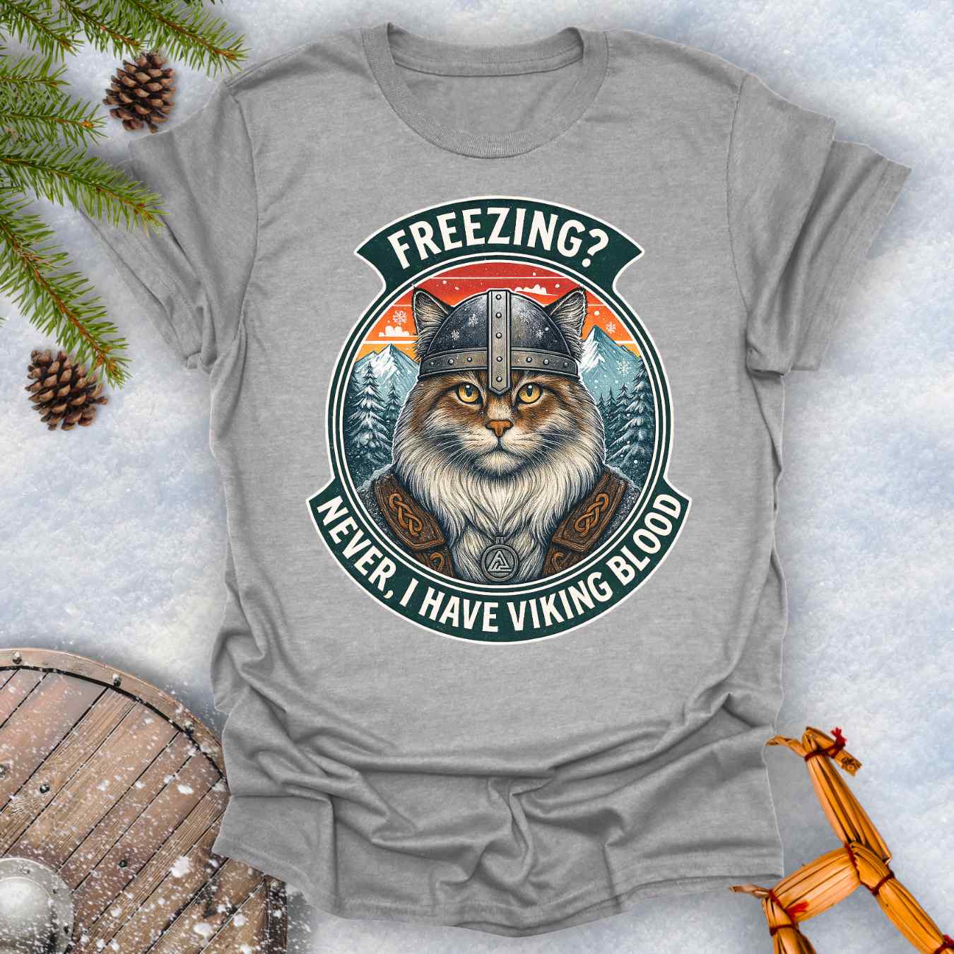 Gray Sports grey T-Shirt with a graphic of a Viking Norwegian Forest Cat and text 'Freezing? Never, I have Viking blood' with a Nordic, retro sunset graphic in the background.