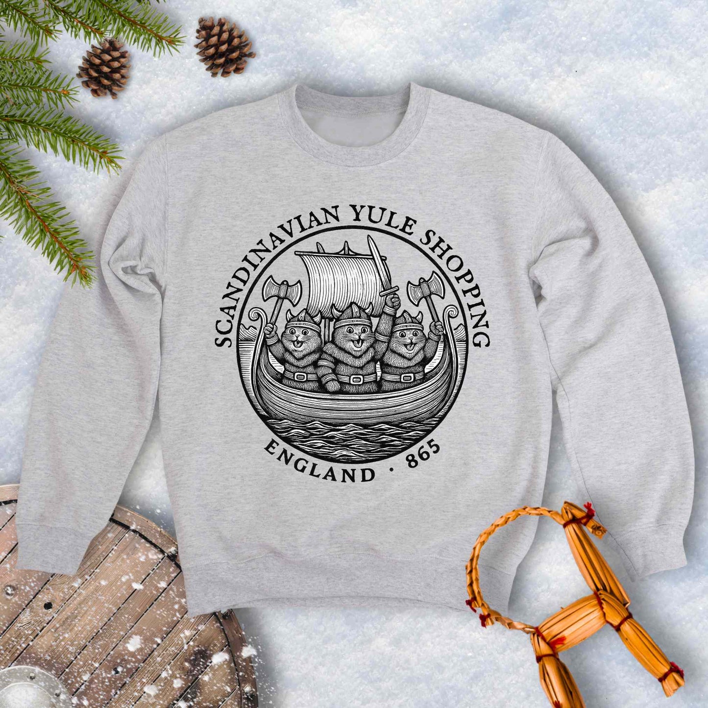 Gray sweatshirt with black and white design with Viking Cats on a Viking ship and text Scandinavian Yule Shopping, England 865.