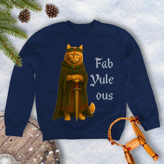Navy Blue sweatshirt with a Shieldmaiden cat in a cloak and sword graphic and 'Fab Yule ous' cross stich lookalike text.