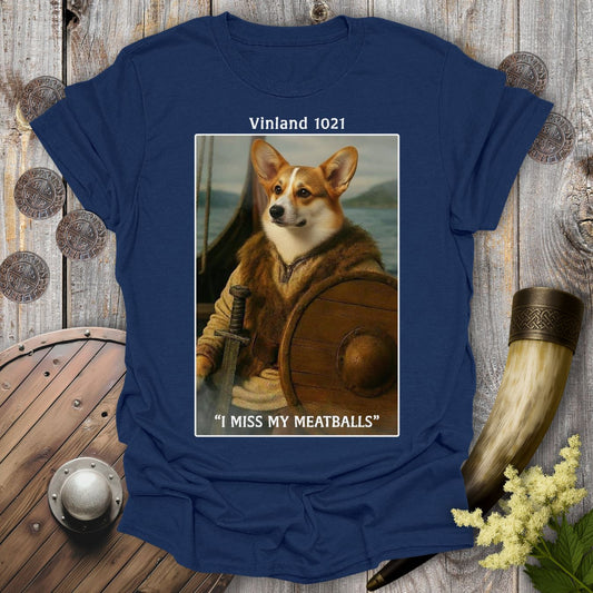 Navy blue t-shirt with a graphic of a Corgi Viking dog as Leif Erikson in a longship with text "Vinland 1021" and "I Miss My Meatballs".