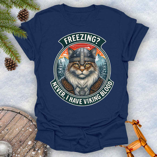 Navy Blue T-Shirt with a graphic of a Viking Norwegian Forest Cat and text 'Freezing? Never, I have Viking blood' with a Nordic, retro sunset graphic in the background.