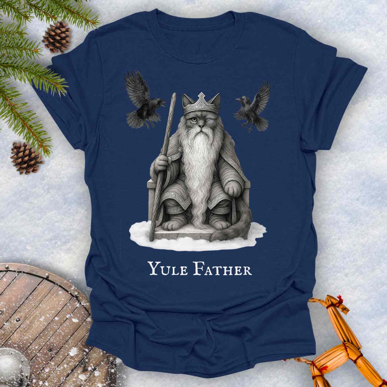 Navy blue T-Shirt with the aesir Odin reimagined as a black cat. Text 'Yule Father' design on a snowy background.