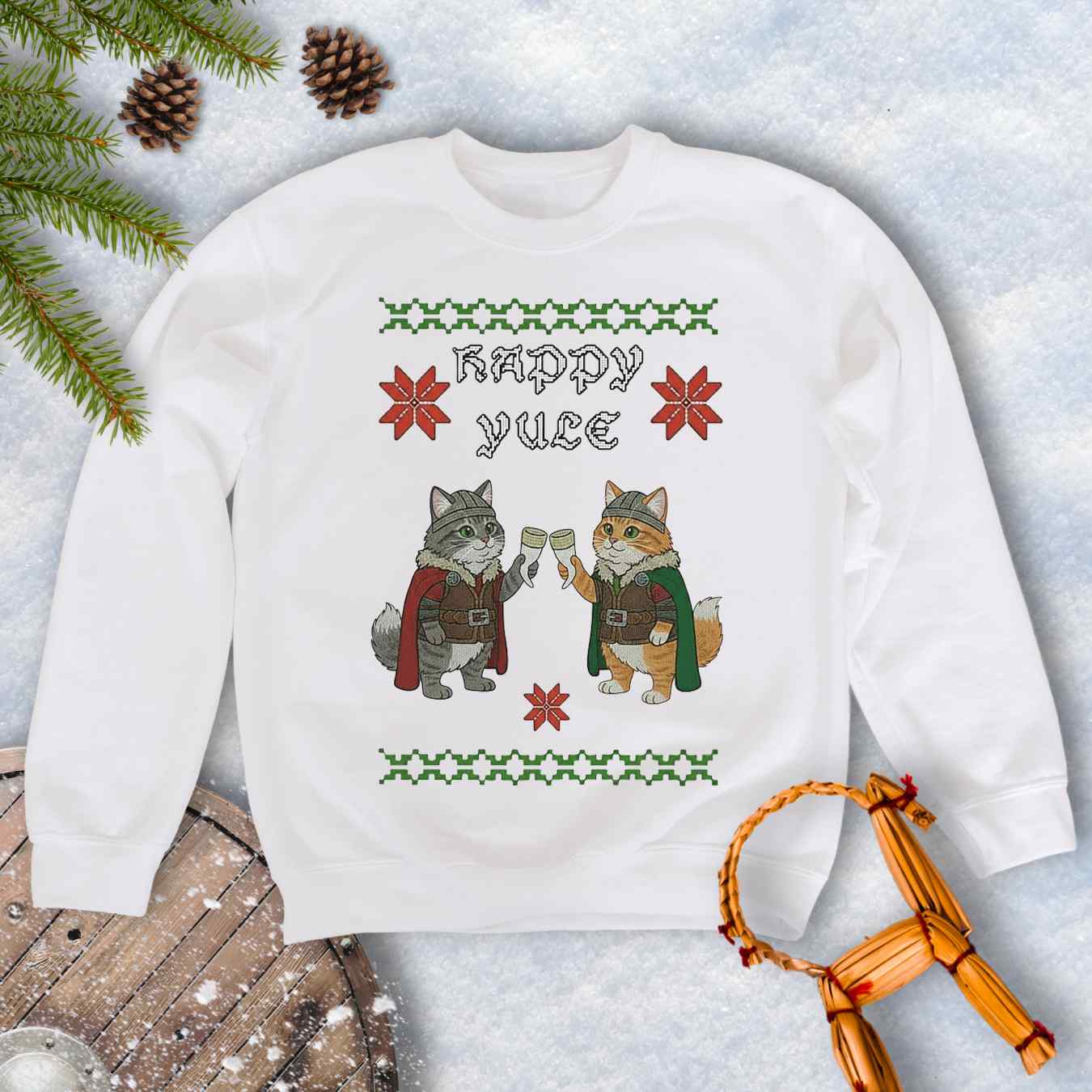 White ugly sweater type sweatshirt with Viking cat design and 'Happy Yule' text on a snowy background.
