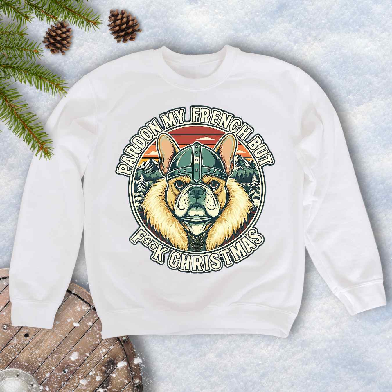 White sweatshirt with a graphic of a Viking French bulldog wearing a helmet and Norse winter retro sunset in the background. Text "Pardon My French but F**K Christmas".