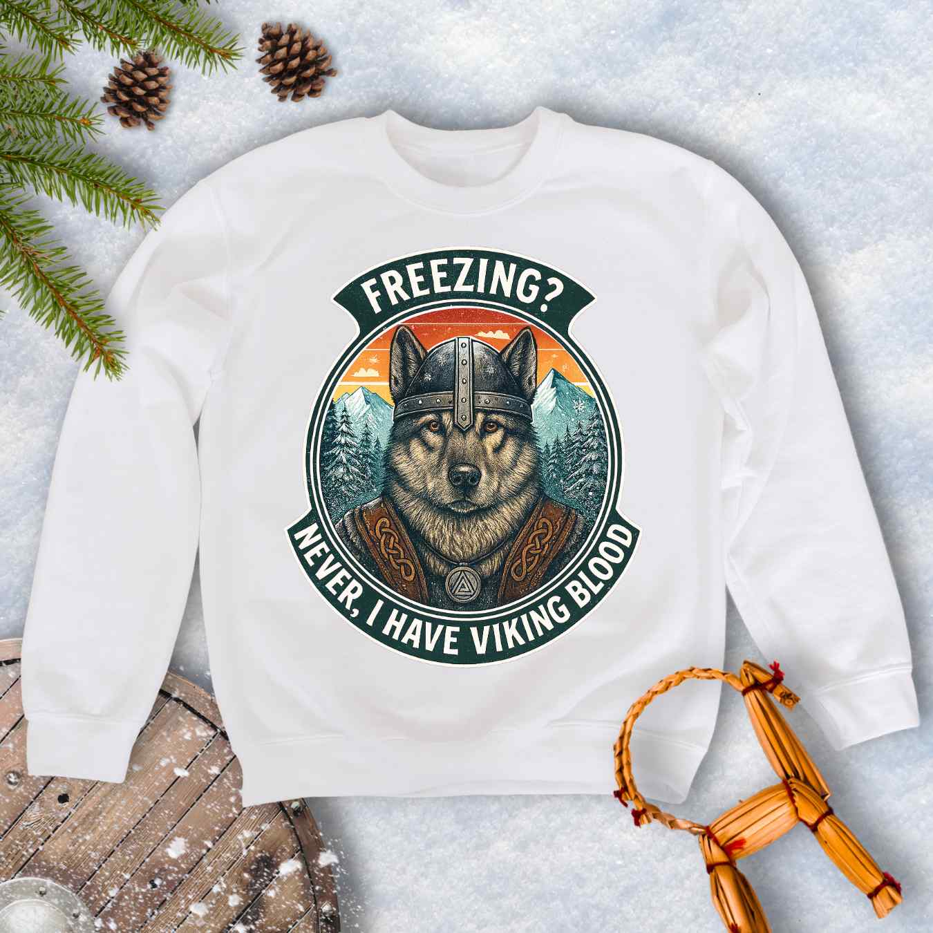 White sweatshirt with a graphic of a Viking Norwegian Elkhound and text 'Freezing? Never, I have Viking blood' with a Nordic, retro sunset graphic in the background.