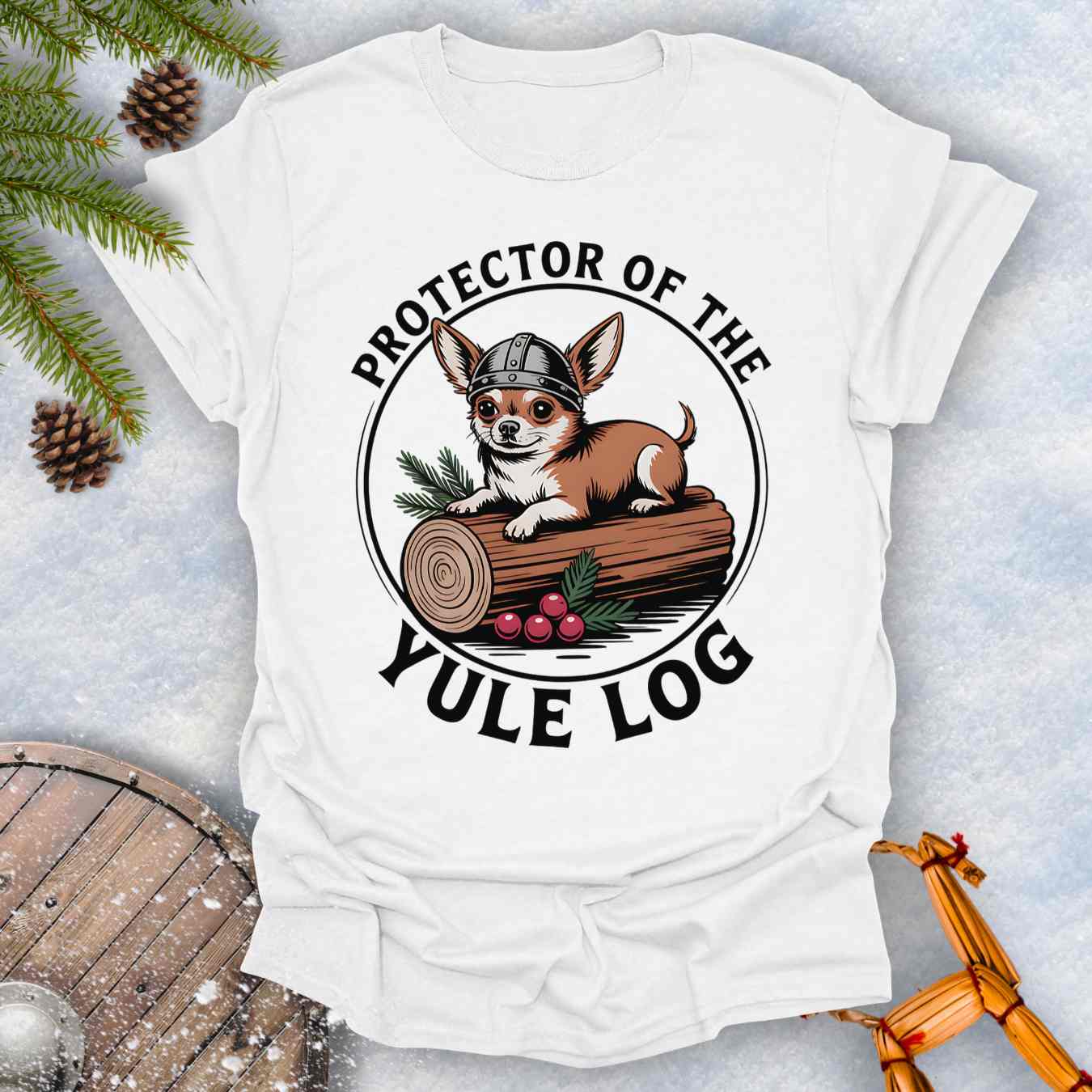 White t-shirt with a Chihuahua Viking dog graphic and 'Protector of the Yule Log' text on a snowy background.