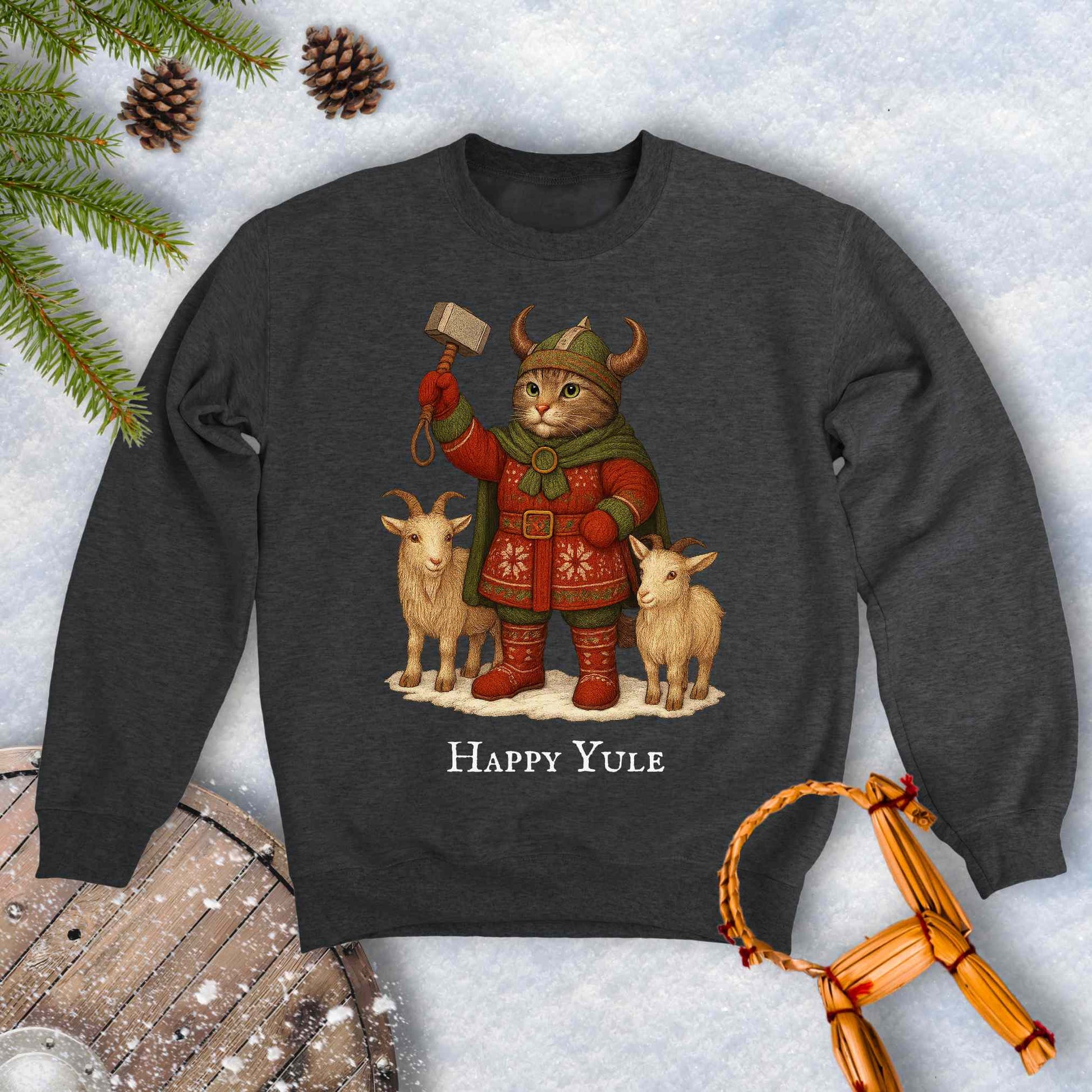 Dark gray sweatshirt with a aesir Thor reimagined Viking cat design and two goats. 'Happy Yule' text on a snowy background.