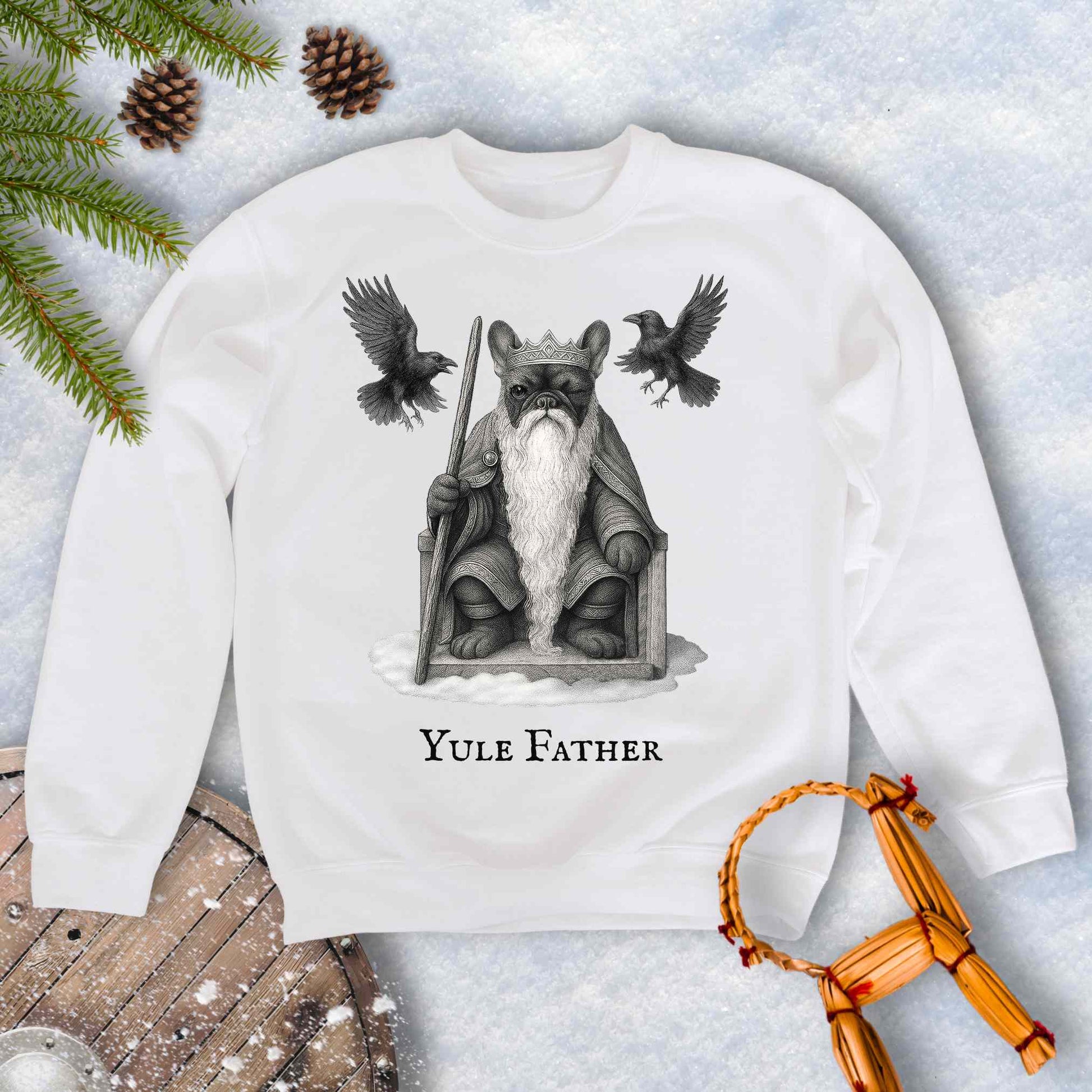 White sweatshirt with 'Yule Father' design, Aesir Odin as a French Bulldog and ravens Huginn and Muninn, on a snowy background