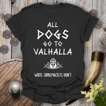 Black t-shirt with 'All dogs go to Valhalla, white supremacists don't' text on a wooden background.