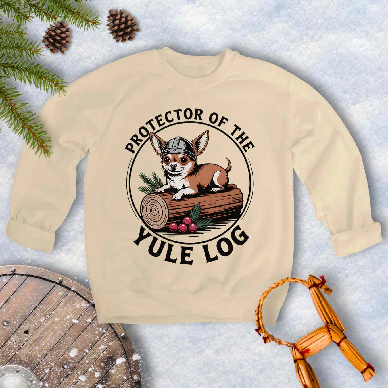 Beige sweatshirt with a Viking Chihuahua dog graphic and text 'Protector of the Yule Log'.