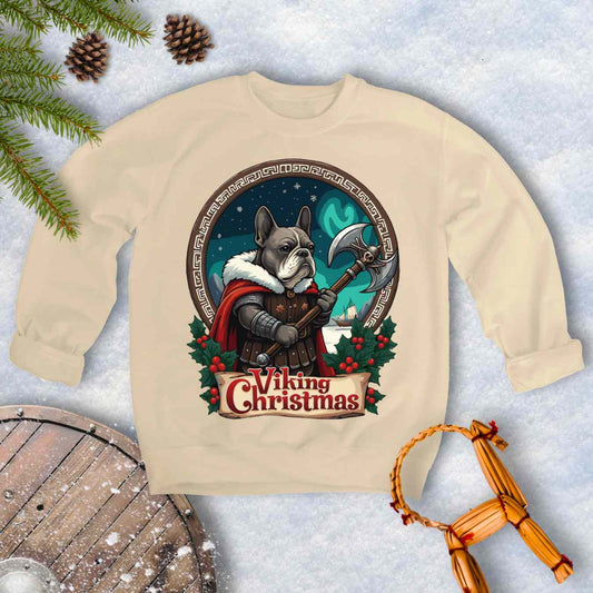 Beige sweatshirt with a Viking-themed Christmas design featuring a Viking Bulldog, axe, and northern lights. Text: Viking Christmas.