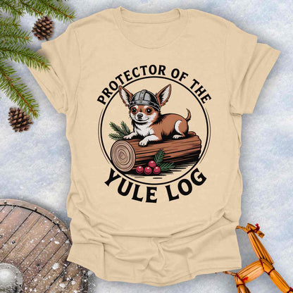 Beige T-shirt with a Chihuahua Viking dog graphic and 'Protector of the Yule Log' text on a snowy background.