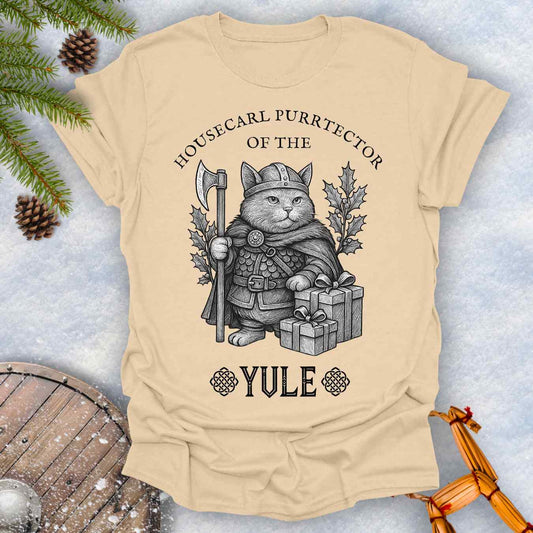 Beige Sand colored t-shirt with a cat in a Viking outfit and Christmas gifts with 'Housecat Purrtecher of the Yule' text. 