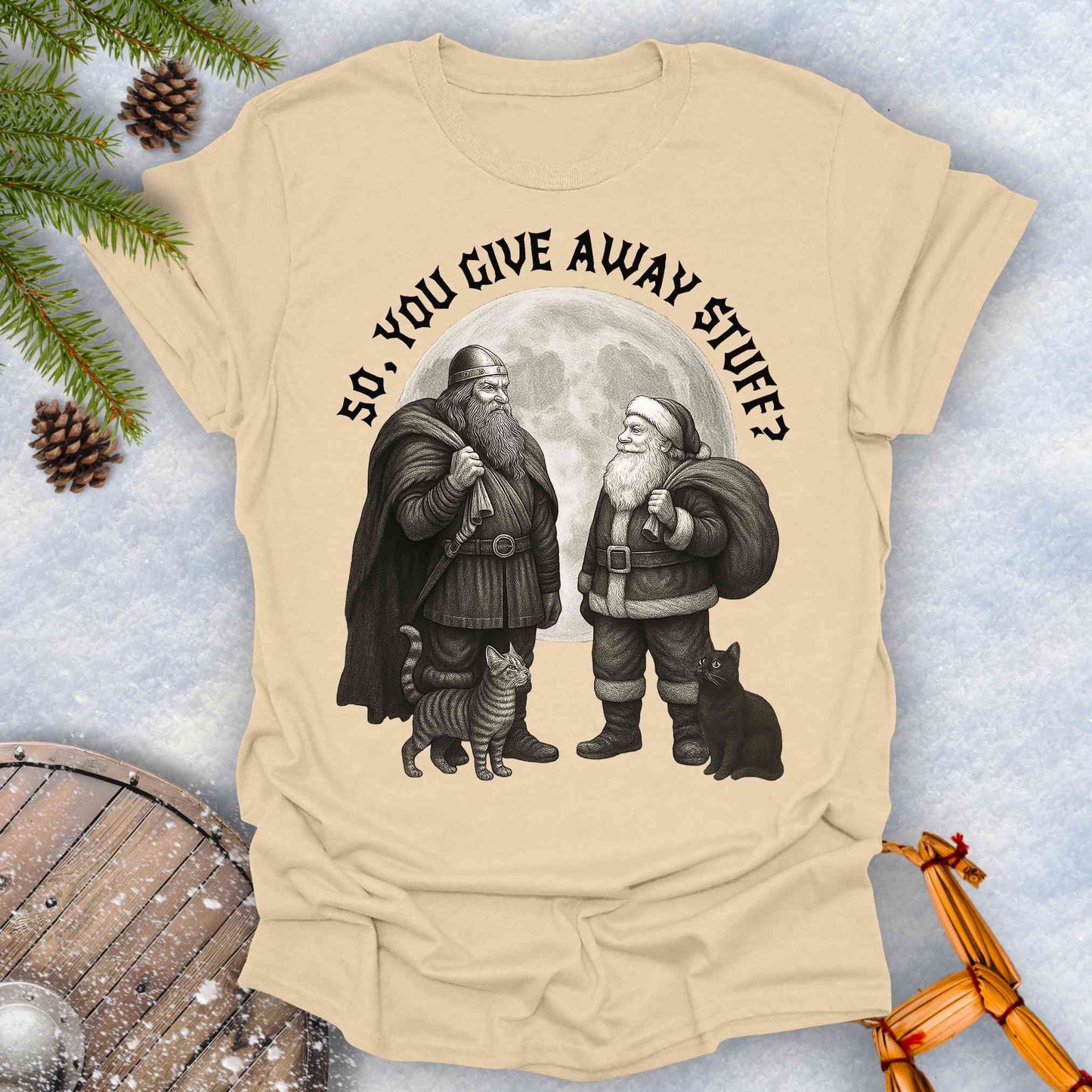 Beige Sand colored t-shirt with graphic of a Viking and Santa Claus with two cats and text 'So, you give away stuff?'.