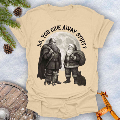 Beige Sand colored t-shirt with graphic of a Viking and Santa Claus with two cats and text 'So, you give away stuff?'.