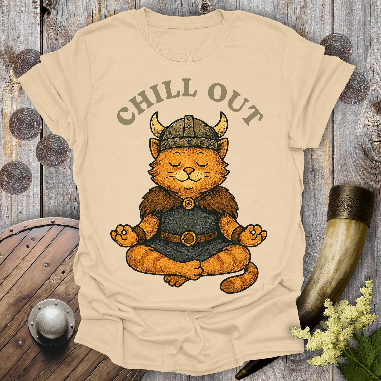 Beige Sand colored t-shirt with a orange tabby cat wearing a Viking helmet meditating and 'Chill Out' text.