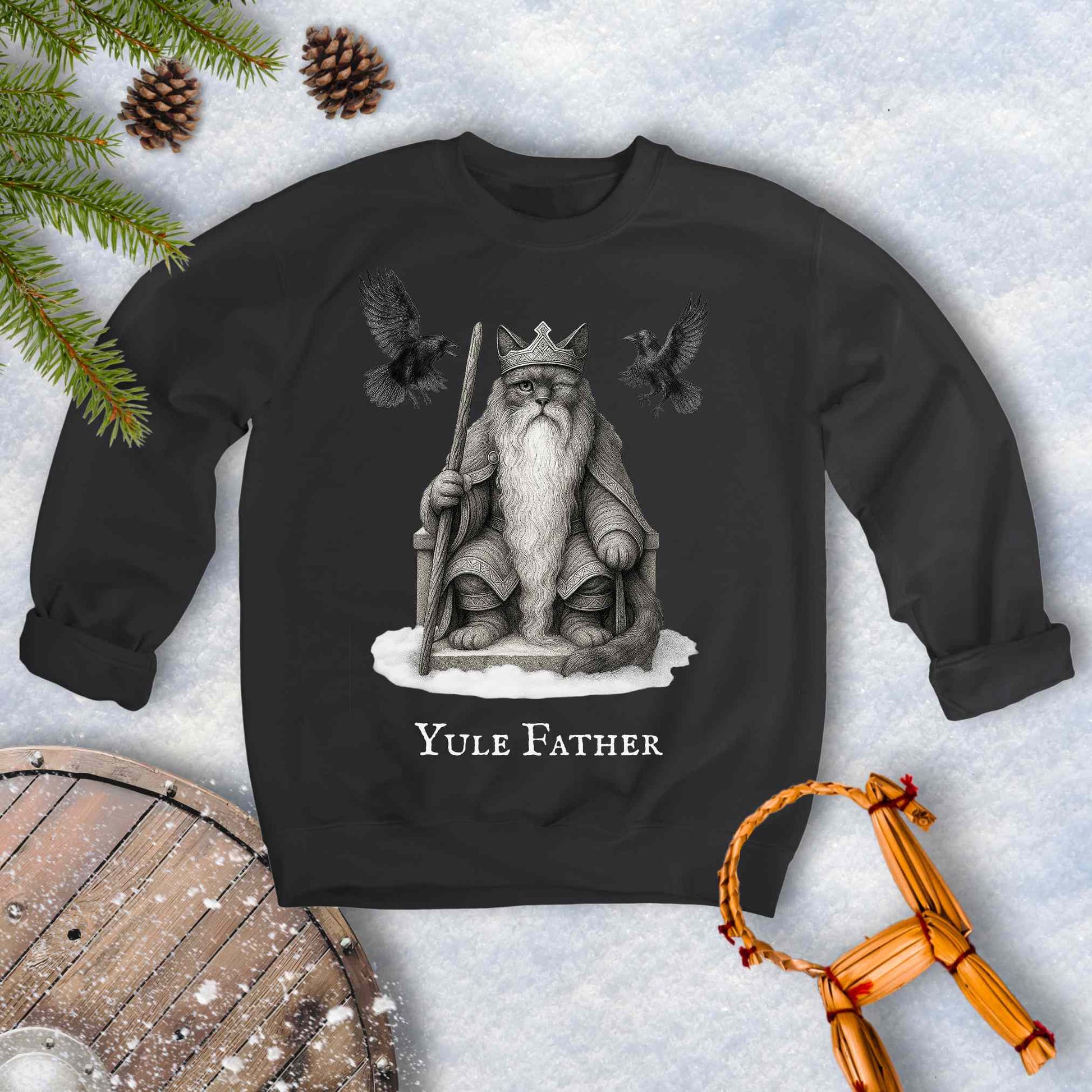 Black sweatshirt with the aesir Odin reimagined as a black cat. Text 'Yule Father' design on a snowy background.