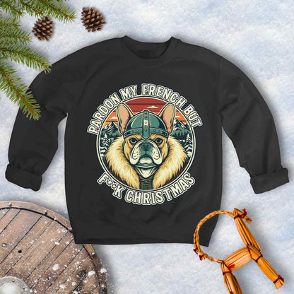 Black sweatshirt with a graphic of a Viking French bulldog wearing a helmet and Norse winter retro sunset in the background. Text "Pardon My French but F**K Christmas".