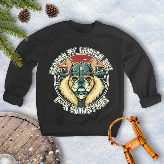 Black sweatshirt with a graphic of a Viking French bulldog wearing a helmet and Norse winter retro sunset in the background. Text "Pardon My French but F**K Christmas".