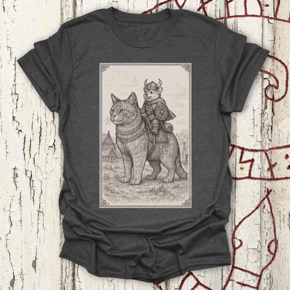 A dark heather gray t-shirt featuring a detailed black and white sketch print of a cat wearing medieval armor with a horned helmet and a Viking corgi dog riding on its back.