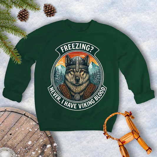 Forest Green sweatshirt with a graphic of a Viking Norwegian Elkhound and text 'Freezing? Never, I have Viking blood' with a Nordic, retro sunset graphic in the background.