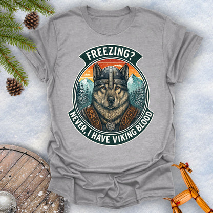 Gray sports grey t-shirt with a graphic of a Viking Norwegian Elkhound and text 'Freezing? Never, I have Viking blood' with a Nordic, retro sunset graphic in the background.