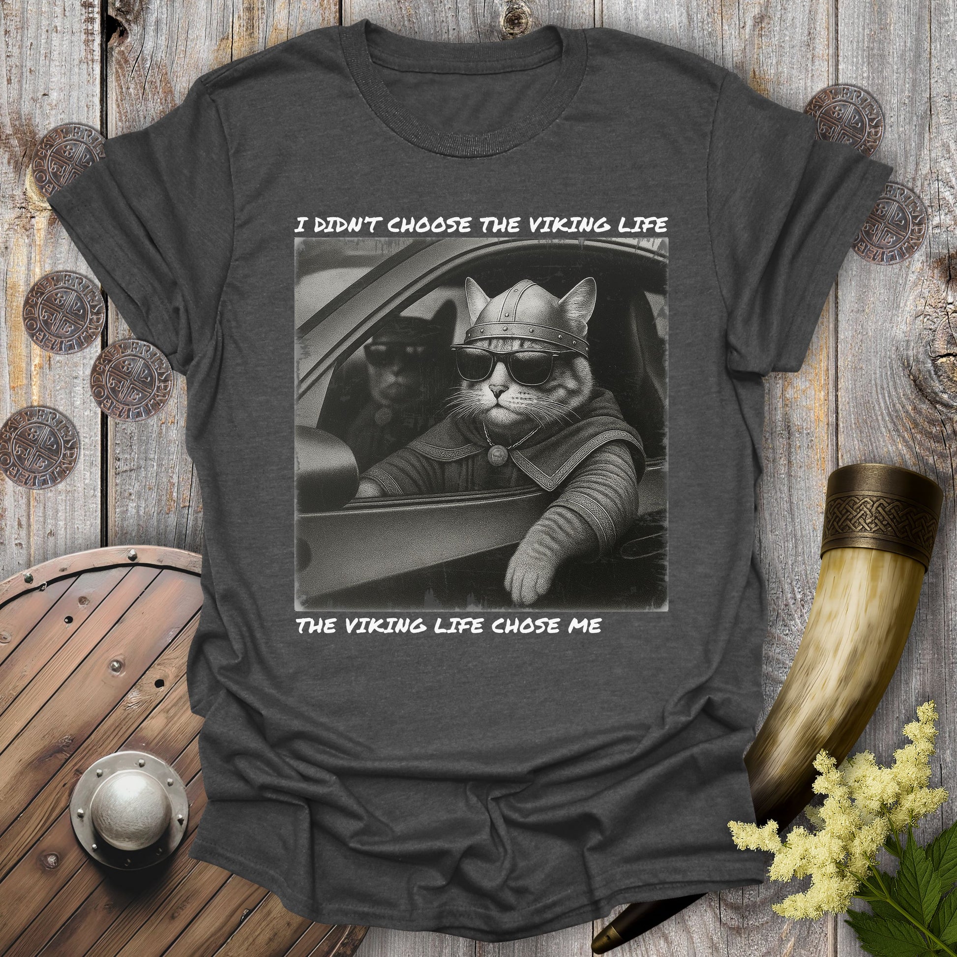 Gray Dark heather t-shirt with a graphic of two Viking cats sitting in a car. Text: I Didn't Choose the Viking Life, the Viking Life Chose Me".
