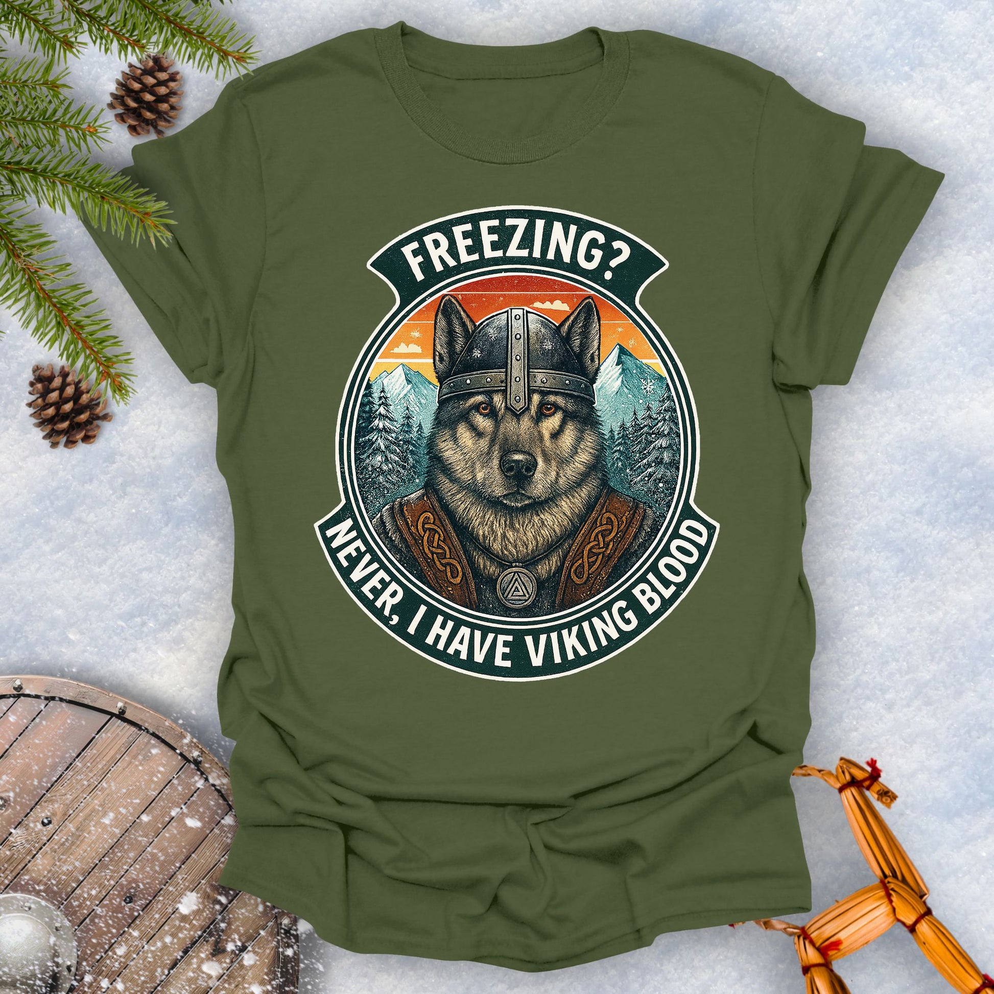 Navy Blue t-shirt with a graphic of a Viking Norwegian Elkhound and text 'Freezing? Never, I have Viking blood' with a Nordic, retro sunset graphic in the background.