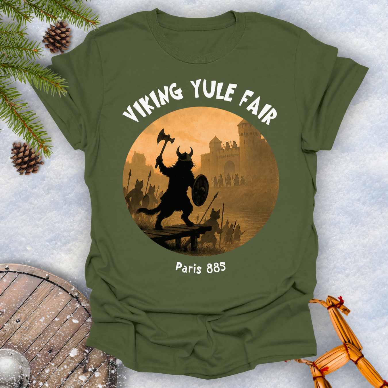 Military Green t-shirt with Viking cat design and white 'Viking Yule Fair' and 'Paris 885' text on a snowy background.