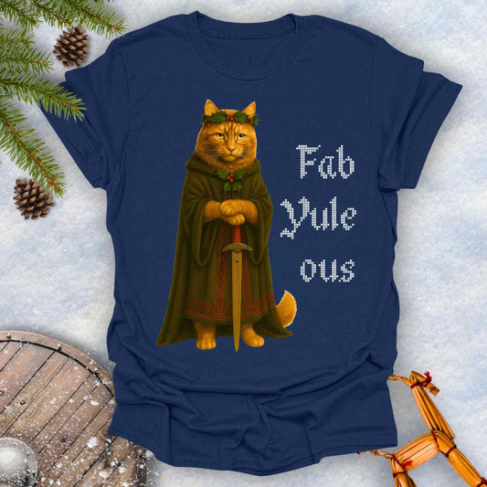 Navy Blue t-shirt with a Shieldmaiden cat in a cloak and sword graphic and 'Fab Yule ous' cross stich lookalike text.