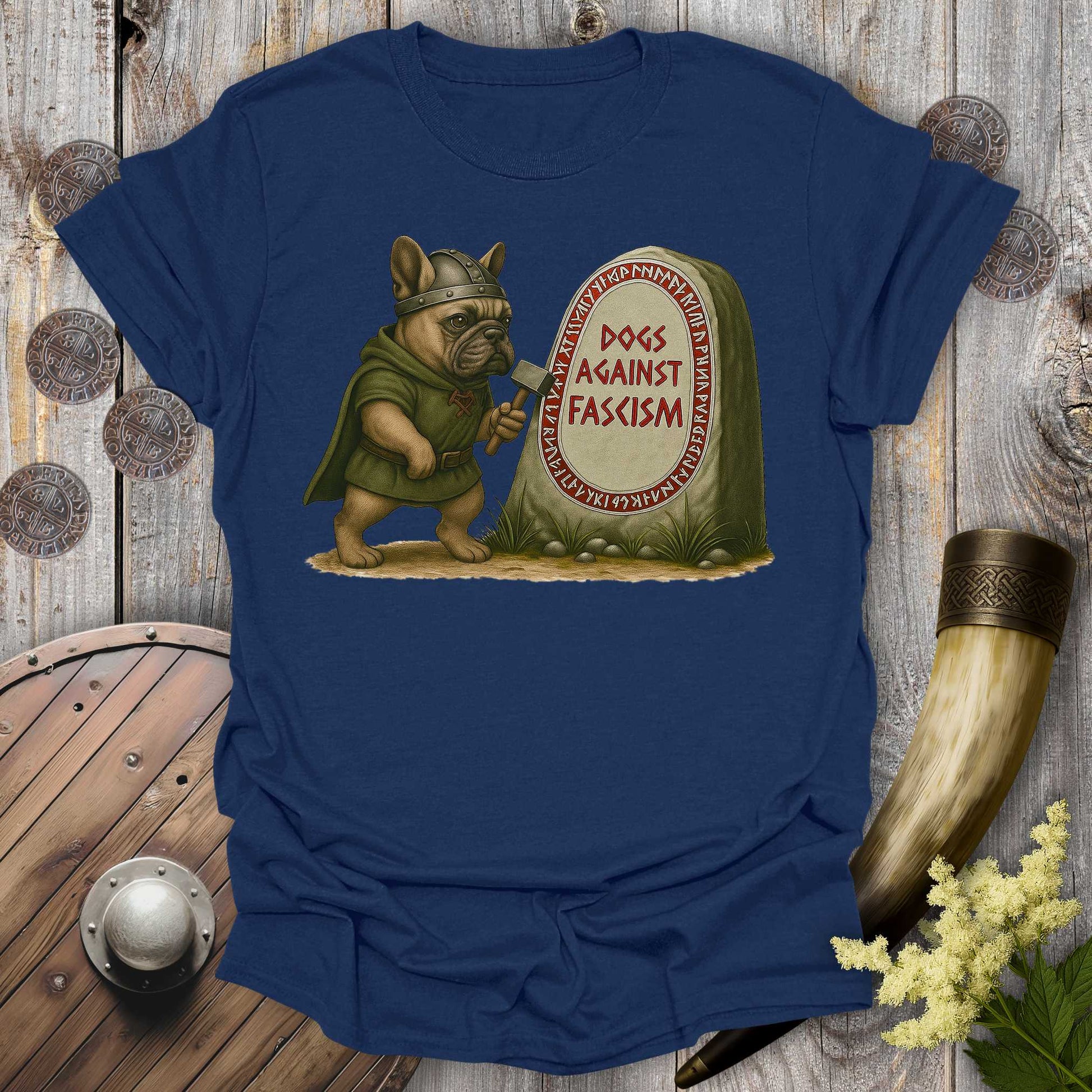 Navy Blue Anti-Fascism No Kings t-shirt with a graphic of a Bulldog in Viking attire holding a hammer next to a stone with "Dogs Against Fascism" text, displayed on a wooden surface.