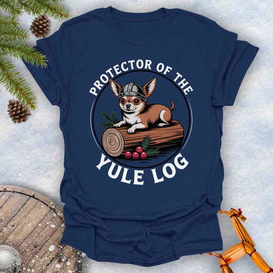 Navy blue t-shirt with a Chihuahua Viking dog graphic and text 'Protector of the Yule Log' on a snowy background.