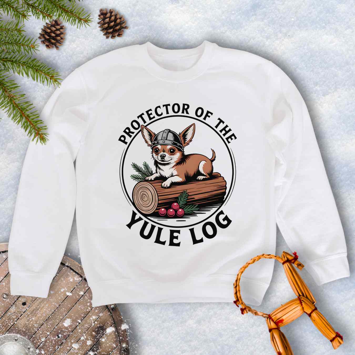 White sweatshirt with a Viking Chihuahua dog graphic and text 'Protector of the Yule Log'.