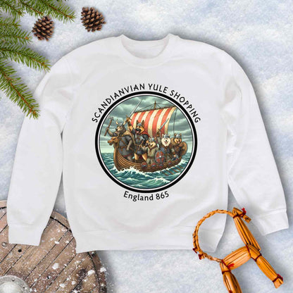 White sweatshirt with Viking Dogs on a Viking ship. Text: Scandinavian Yule Shopping England 865.