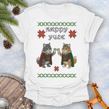 White t-shirt with Holiday festive design, ugly sweater pattern style, of two Viking cats holding drinking horns and 'Happy Yule' text, surrounded by Christmas decorations on a snowy background.