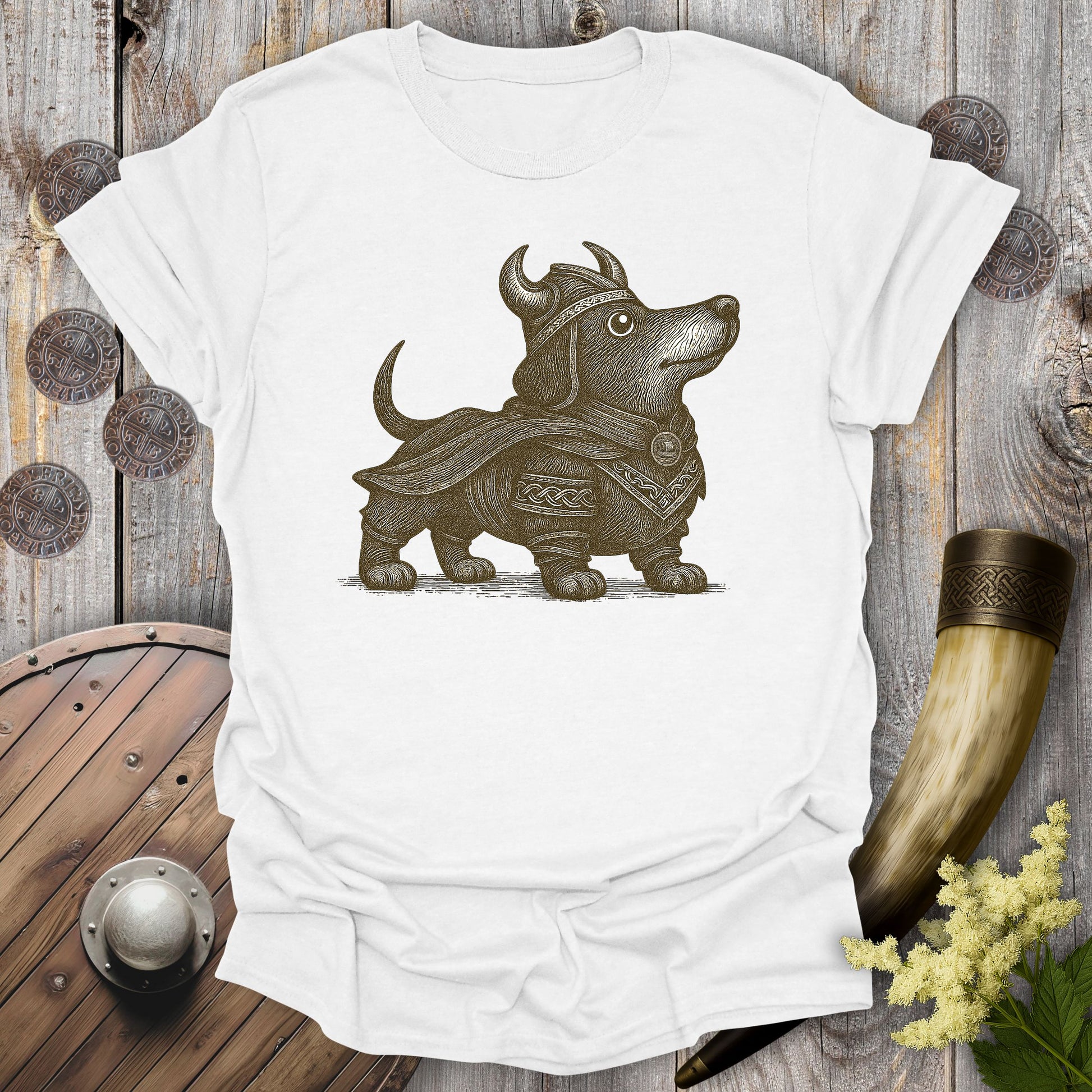White t-shirt with a Viking-themed dachshund brown graphic on a wooden background.